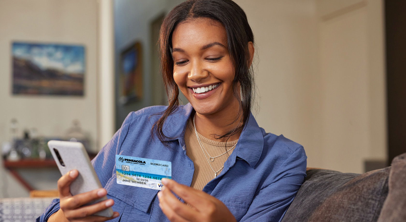 Woman holding credit card and Smartphone