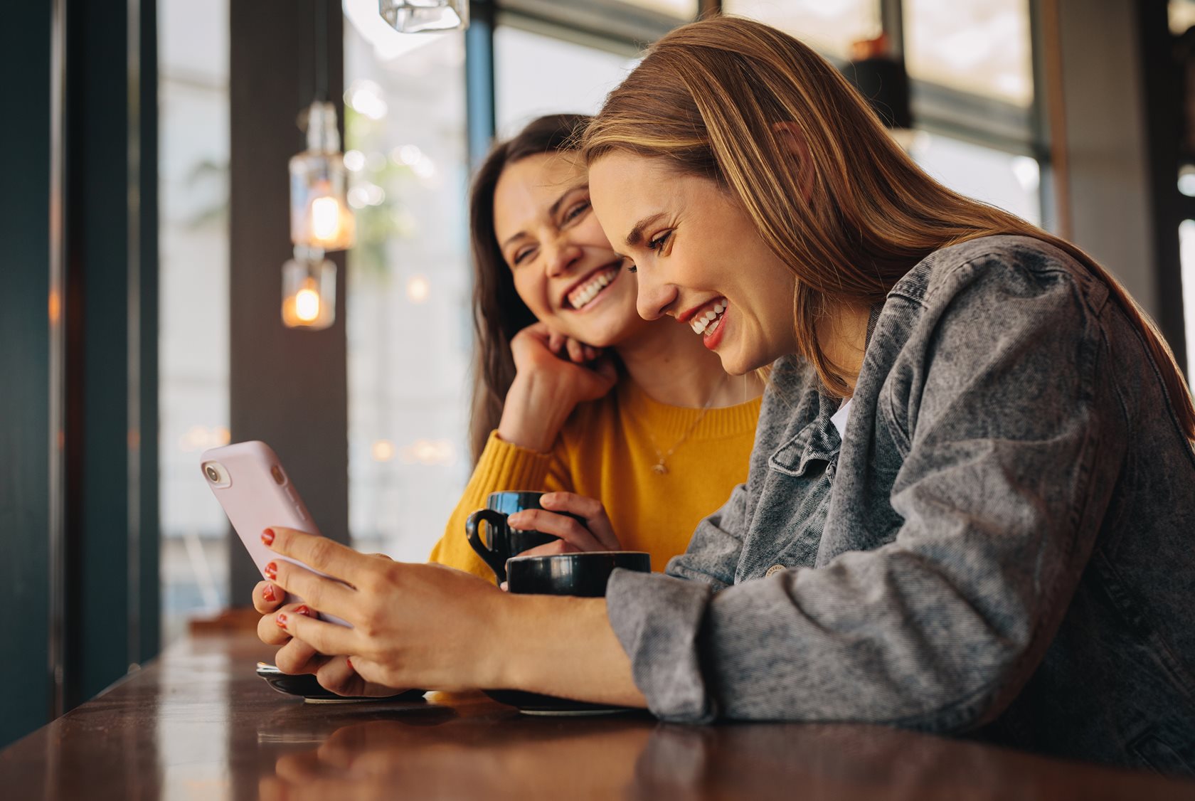 Two woman looking at smartphone