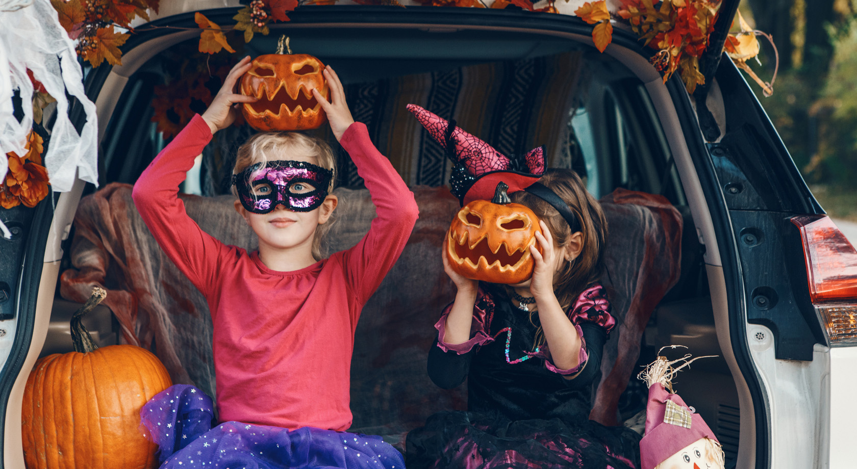 Young girls with pumpkins